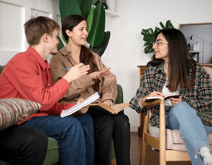 three-friends-learning-using-their-notebooks-study-session