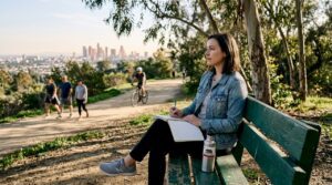 Woman journaling quietly in California park